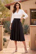 Black and white two tone long sleeve pleated midi dress, front view