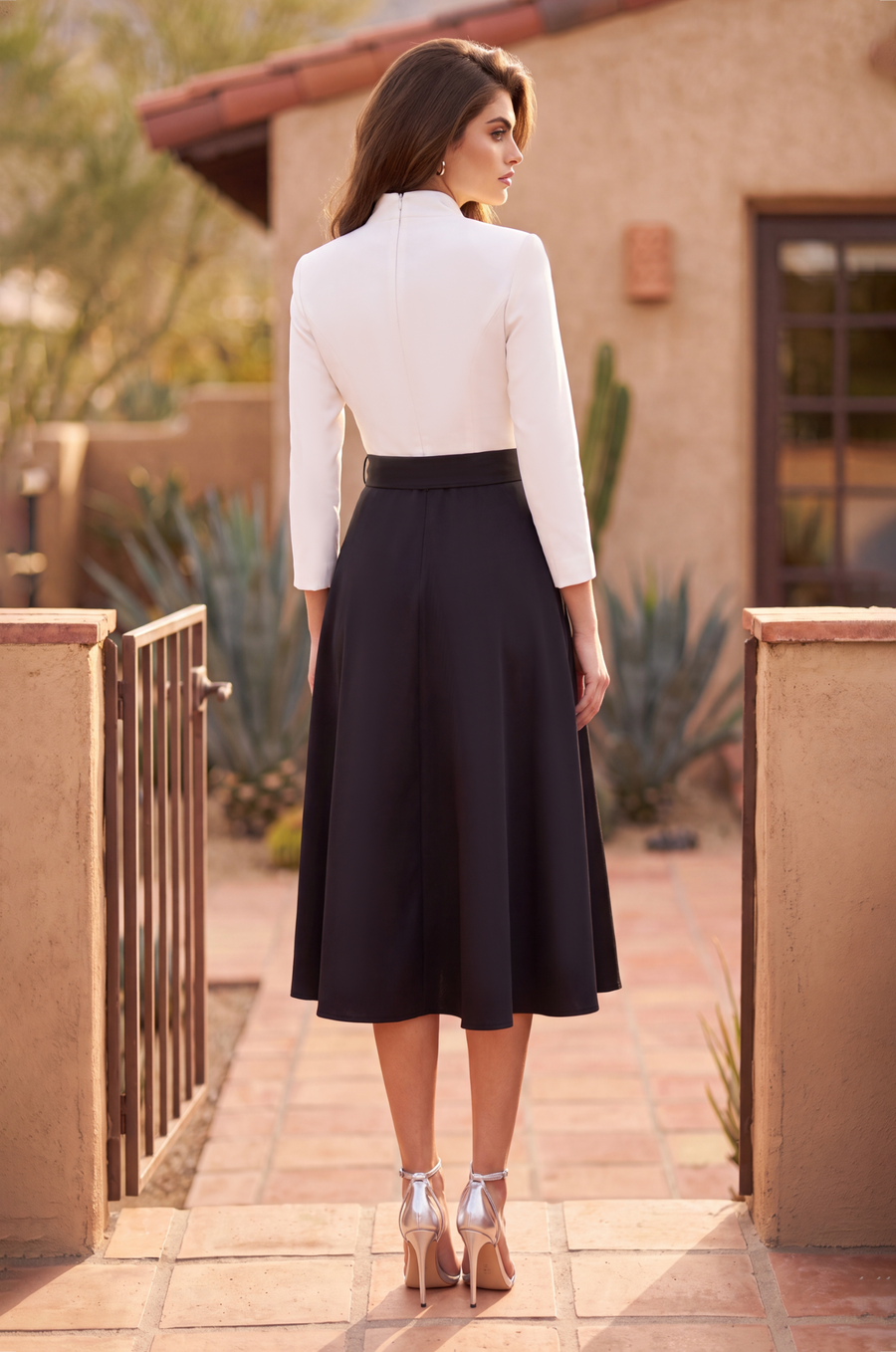 Black and white two tone long sleeve pleated midi dress, side view
