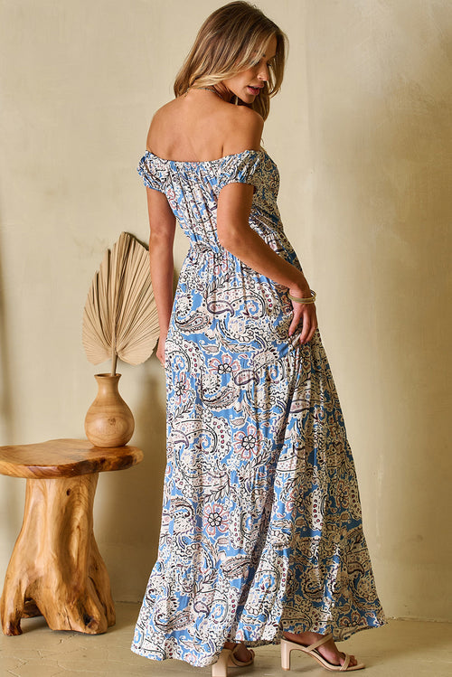 Back view of blue floral off-shoulder maxi dress showing fit and drape